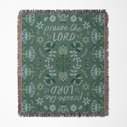 Green floral patterned blanket with 'praise the LORD' text on a white background