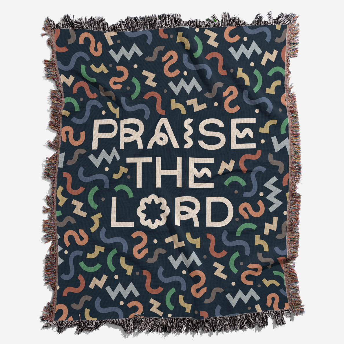 Blanket with 'PRAISE THE LORD' text and colorful patterns on a dark background