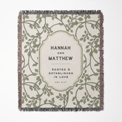 Blanket with leaf pattern and text 'Hannah and Matthew Rooted & Established in Love Eph 3:17' on a white background