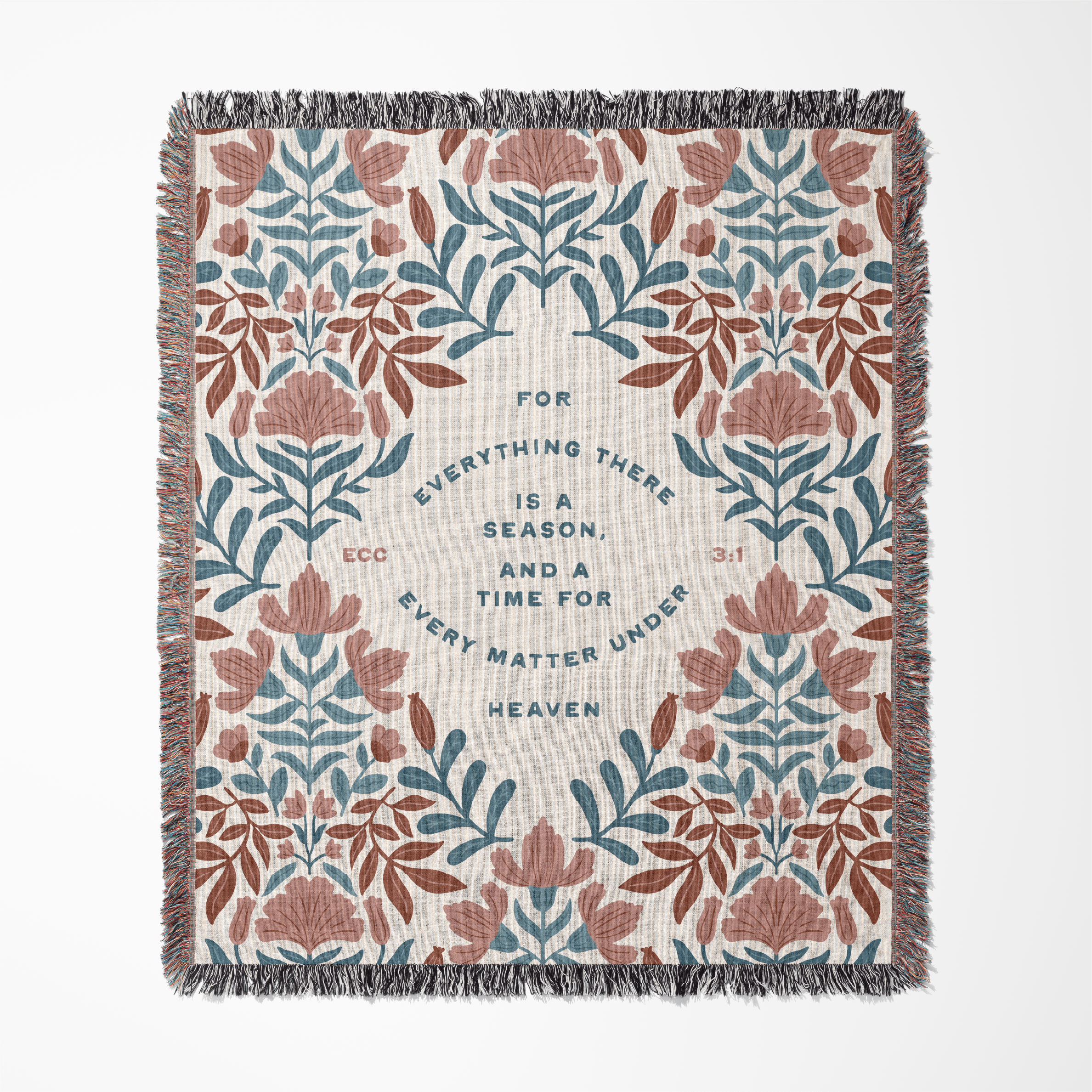 Floral patterned throw blanket with text on a white background