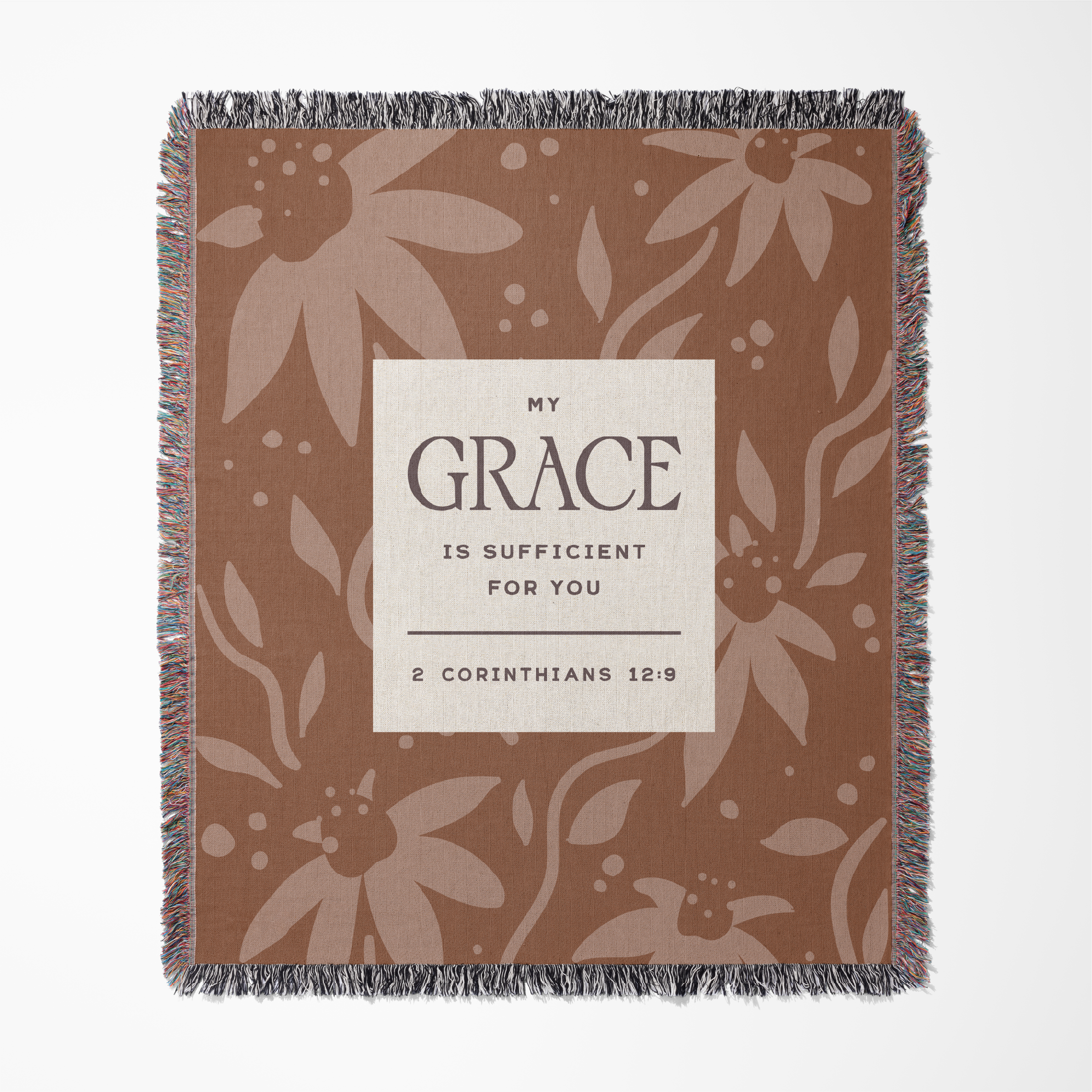 Floral patterned blanket with a motivational quote on a white background