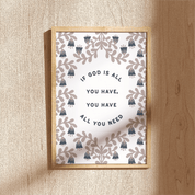 Framed print with decorative design and motivational quote on a wooden surface