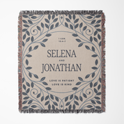 Personalized throw blanket with decorative border and text on a beige background