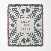 Blanket with leaf pattern and 'Love Like Jesus' text on a white background