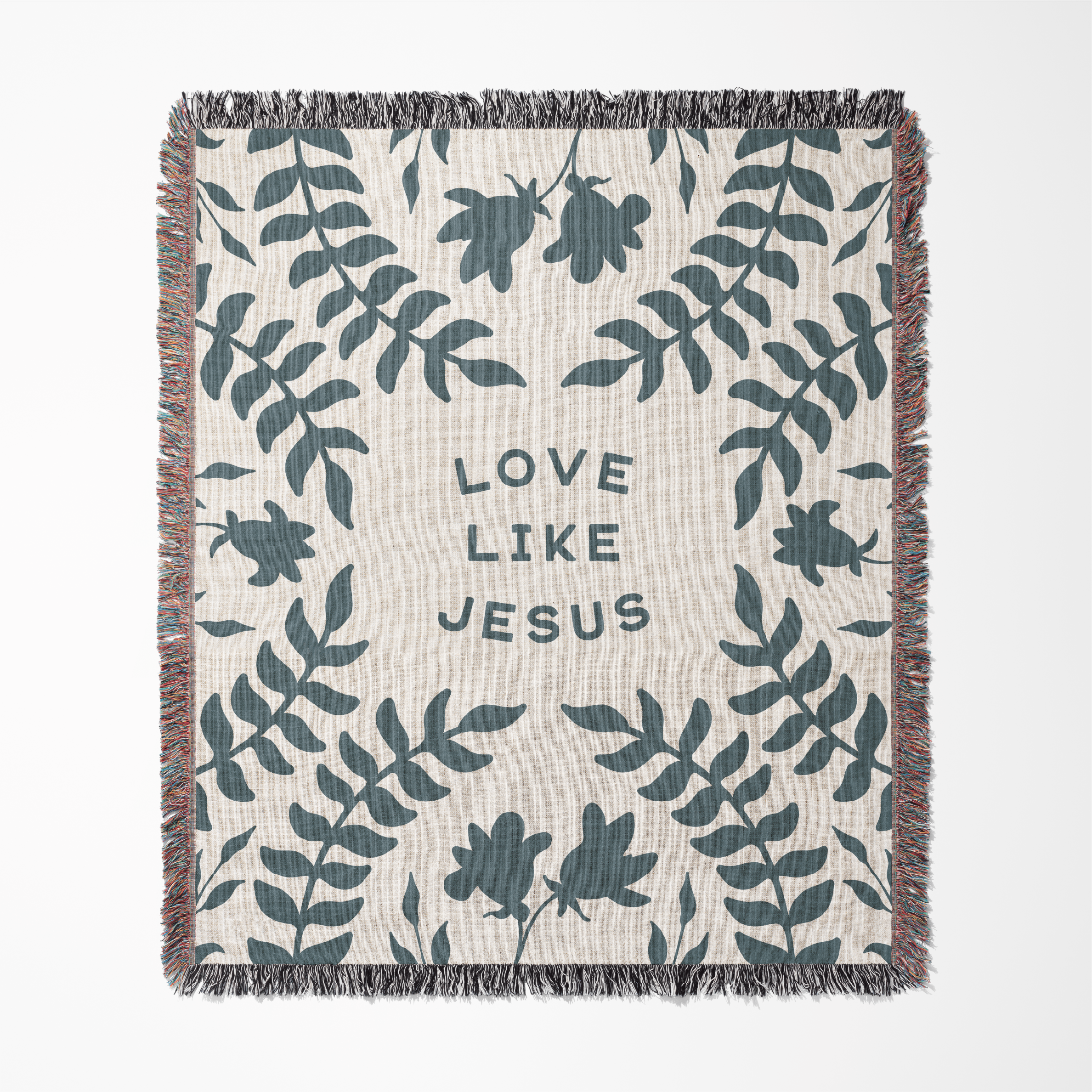 Blanket with leaf pattern and 'Love Like Jesus' text on a white background