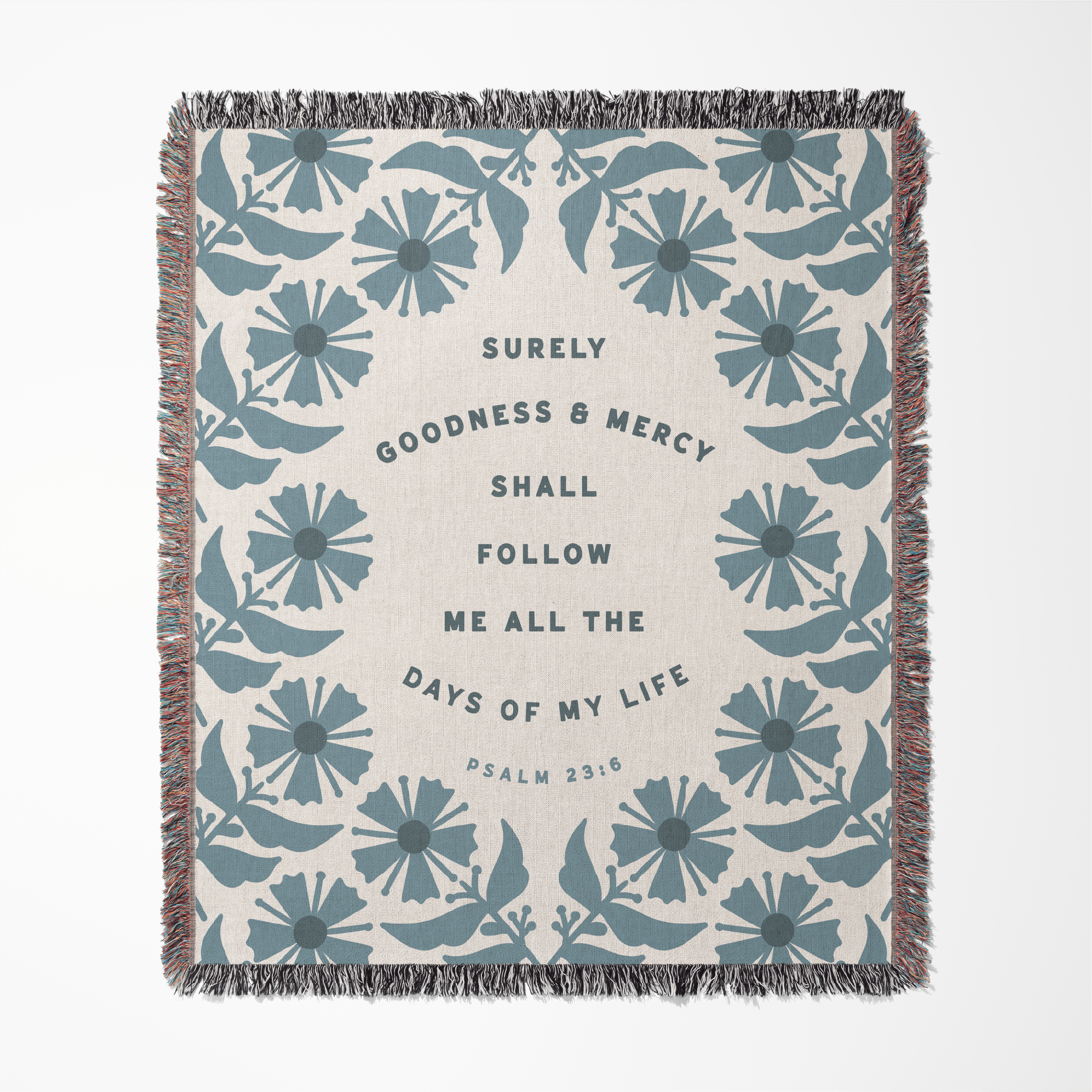 Floral patterned blanket with text on a white background