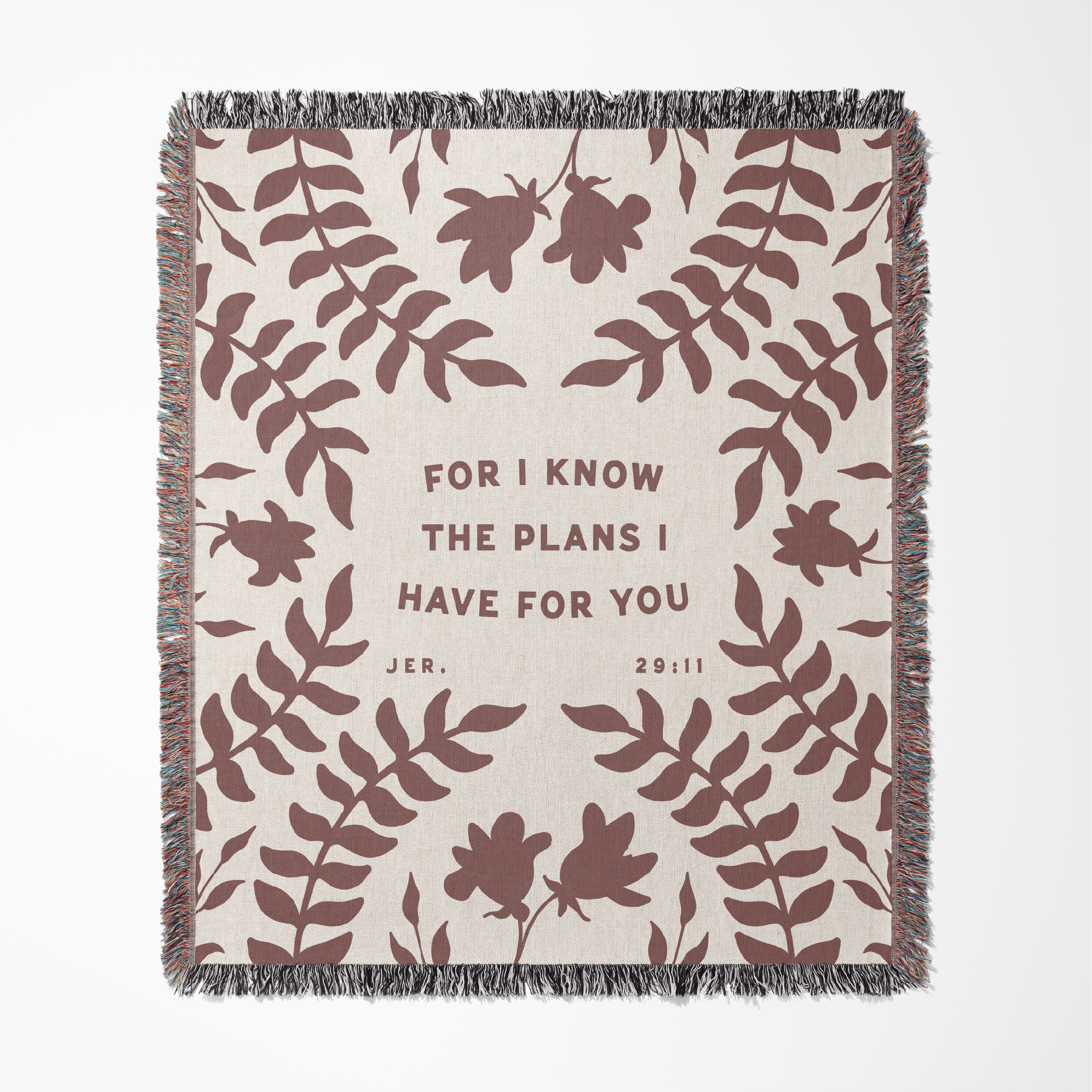 Blanket with leaf pattern and text 'For I know the plans I have for you' on a white background