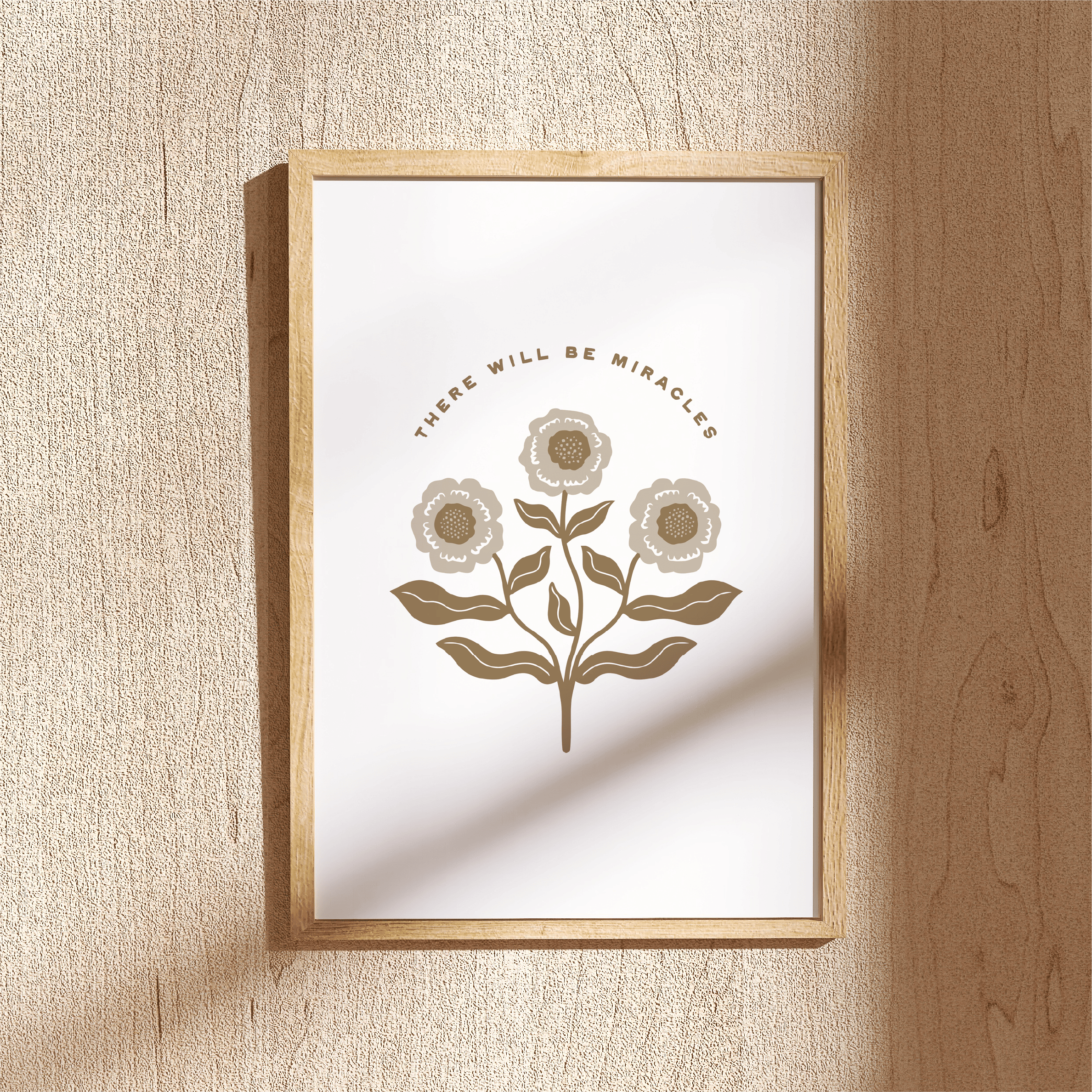 Framed artwork with floral design and text on a textured wall.