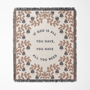 Blanket with decorative pattern and motivational quote on a white background