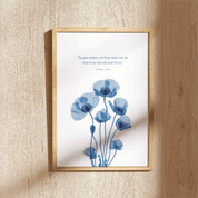 Framed artwork with blue floral design and text on a beige wall.