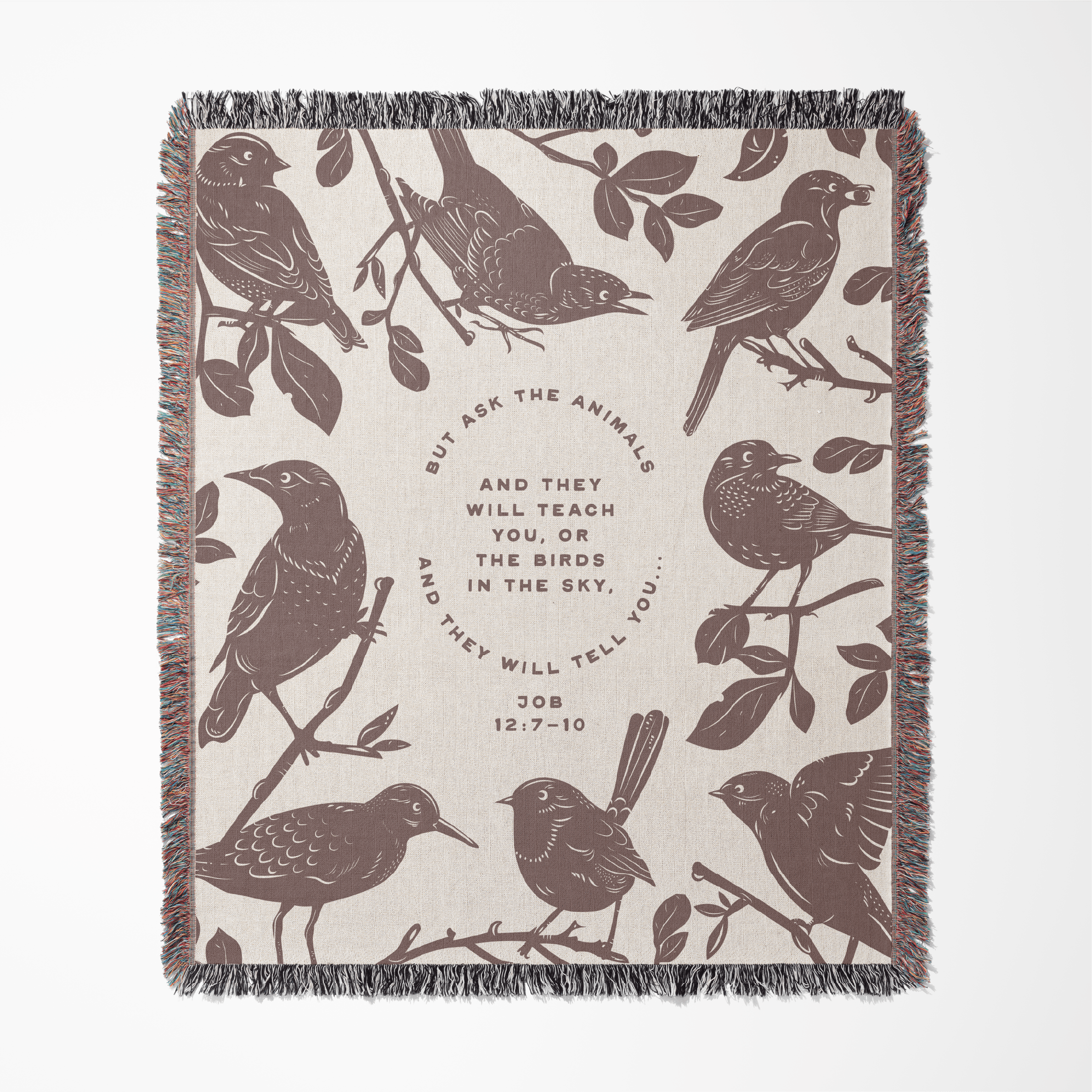 Blanket with bird pattern and text on a beige background