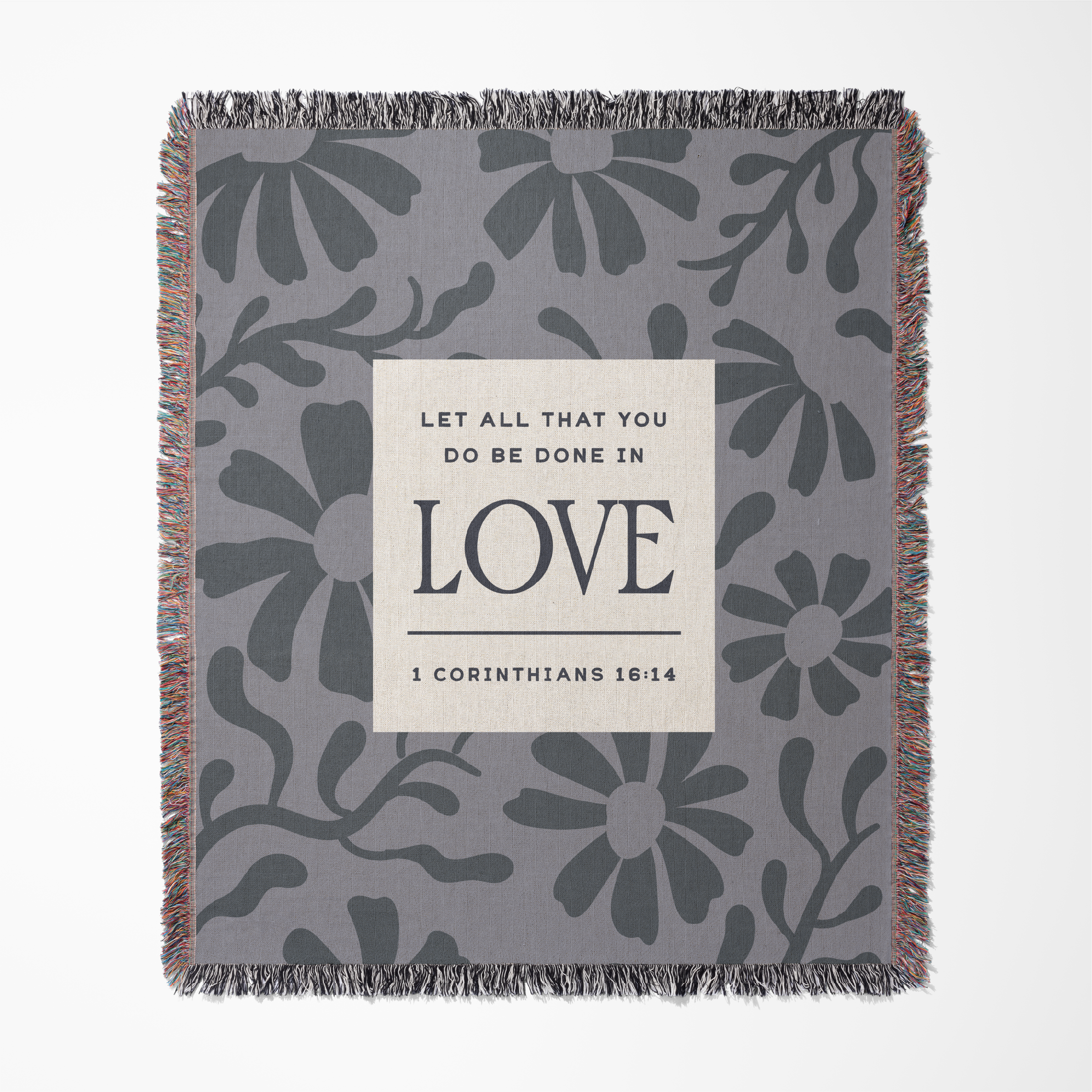 Floral patterned blanket with a motivational quote on a white background