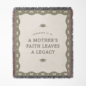 Blanket with text 'A Mother's Faith Leaves a Legacy' and decorative border on a white background