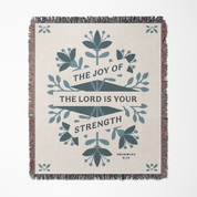 Blanket with floral design and text 'The Joy of the Lord is Your Strength' on a white background