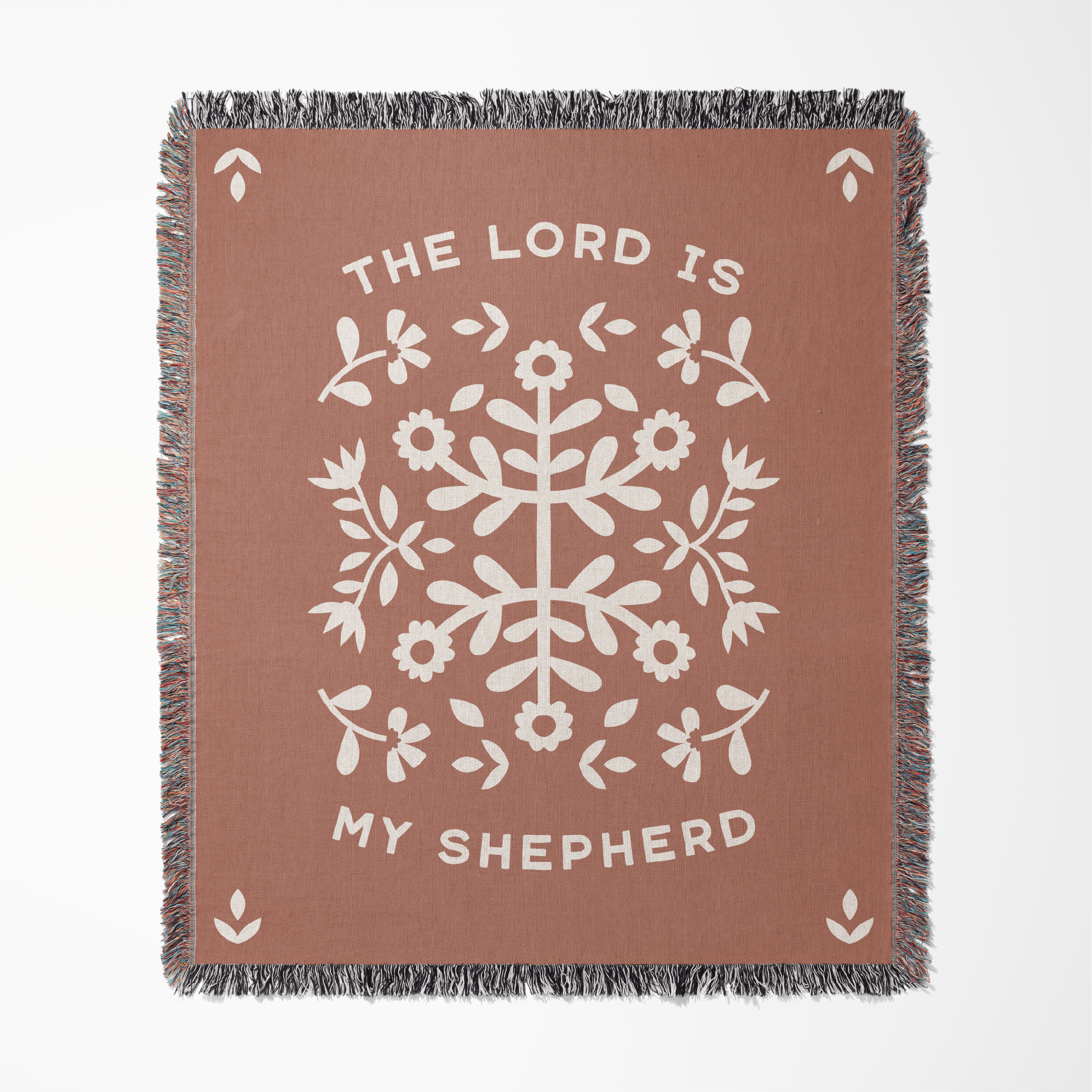Brown blanket with white floral pattern and 'The Lord is My Shepherd' text on a white background