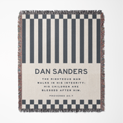 Striped blanket with text and design elements on a white background