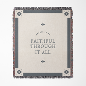 Blanket with 'Faithful Through It All' text and decorative border on a white background