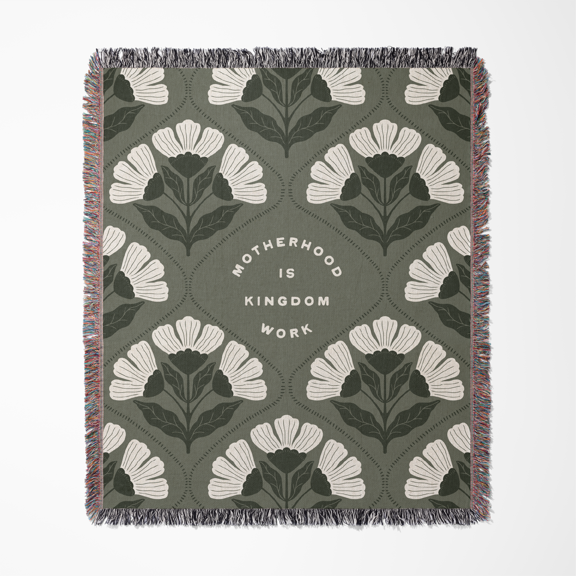 Floral patterned throw blanket with text on a green background