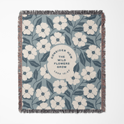 Floral patterned blanket with text on a white background