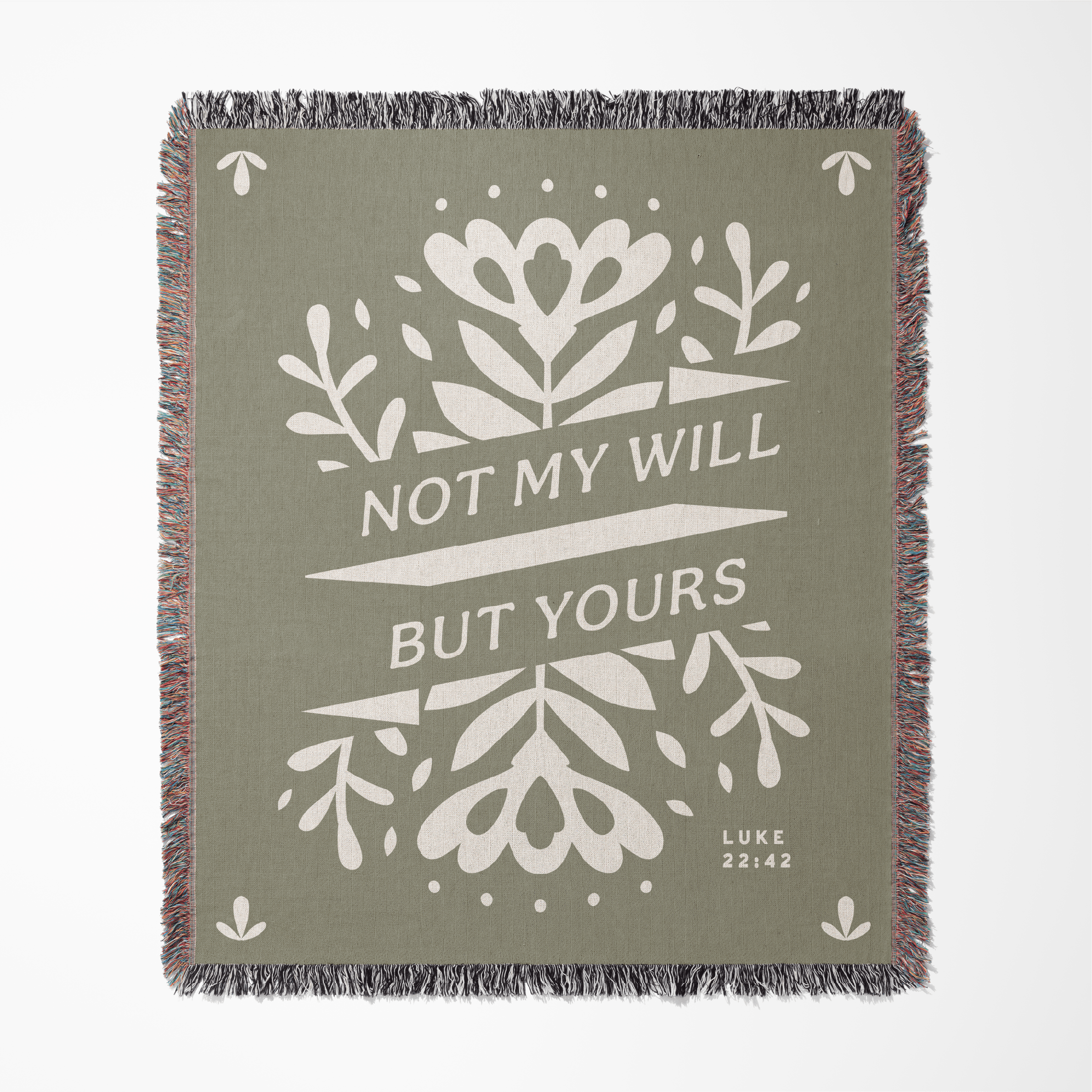 Green blanket with white floral design and text 'Not my will but yours' on a white background