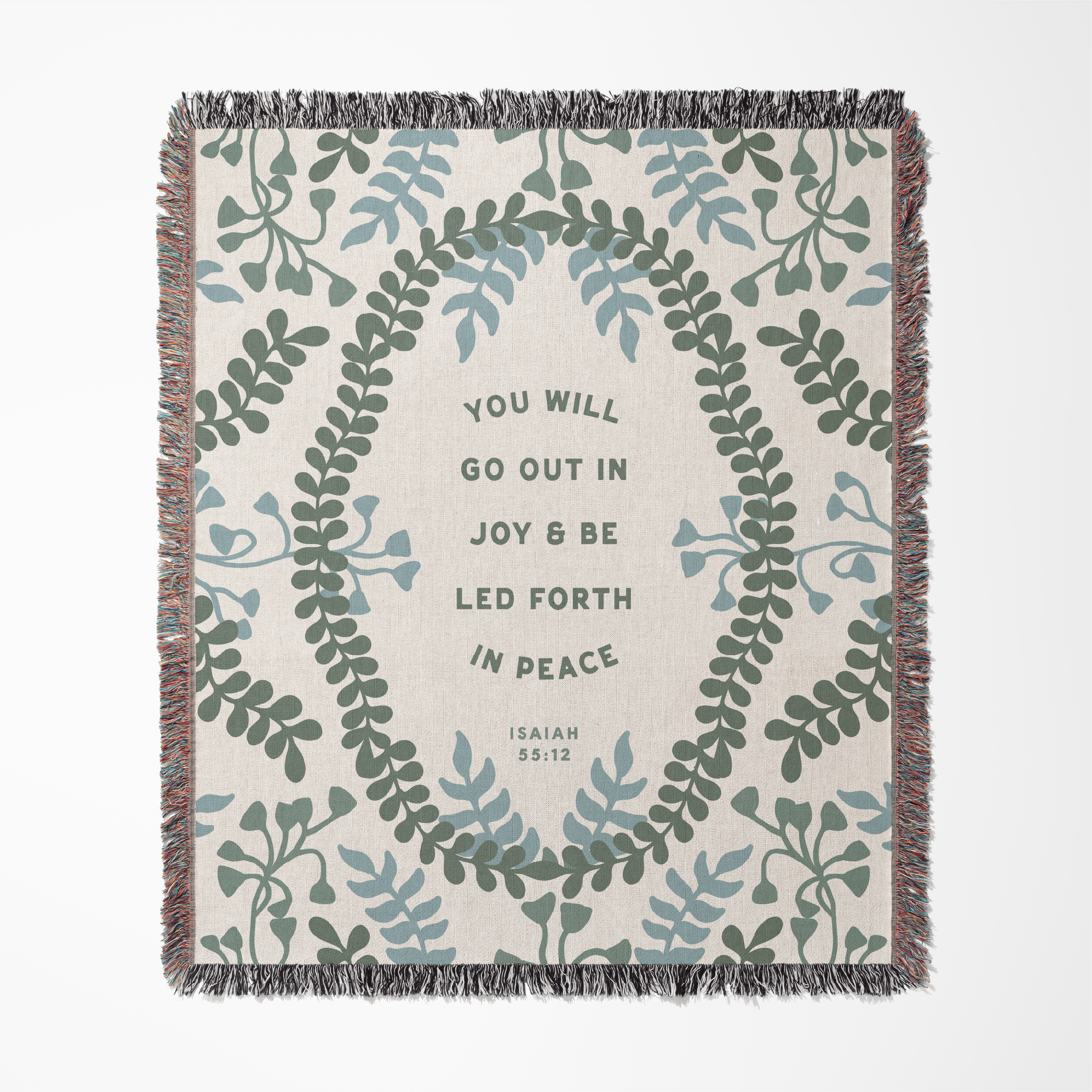 Decorative throw blanket with leaf pattern and inspirational quote on a white background