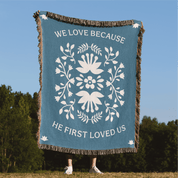 Blanket with decorative design and text in a natural setting