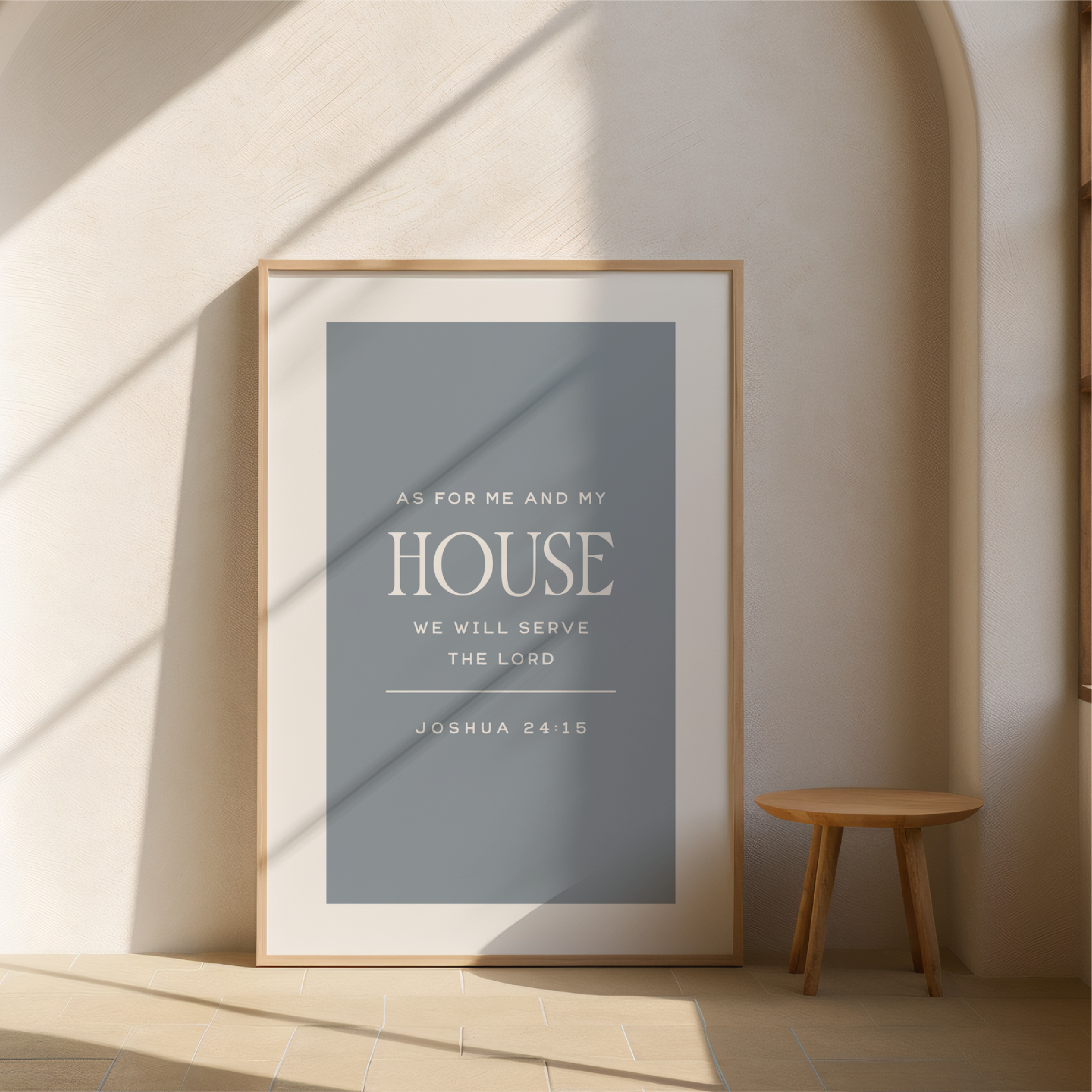 Framed poster with inspirational quote on a wall in a minimalistic room.