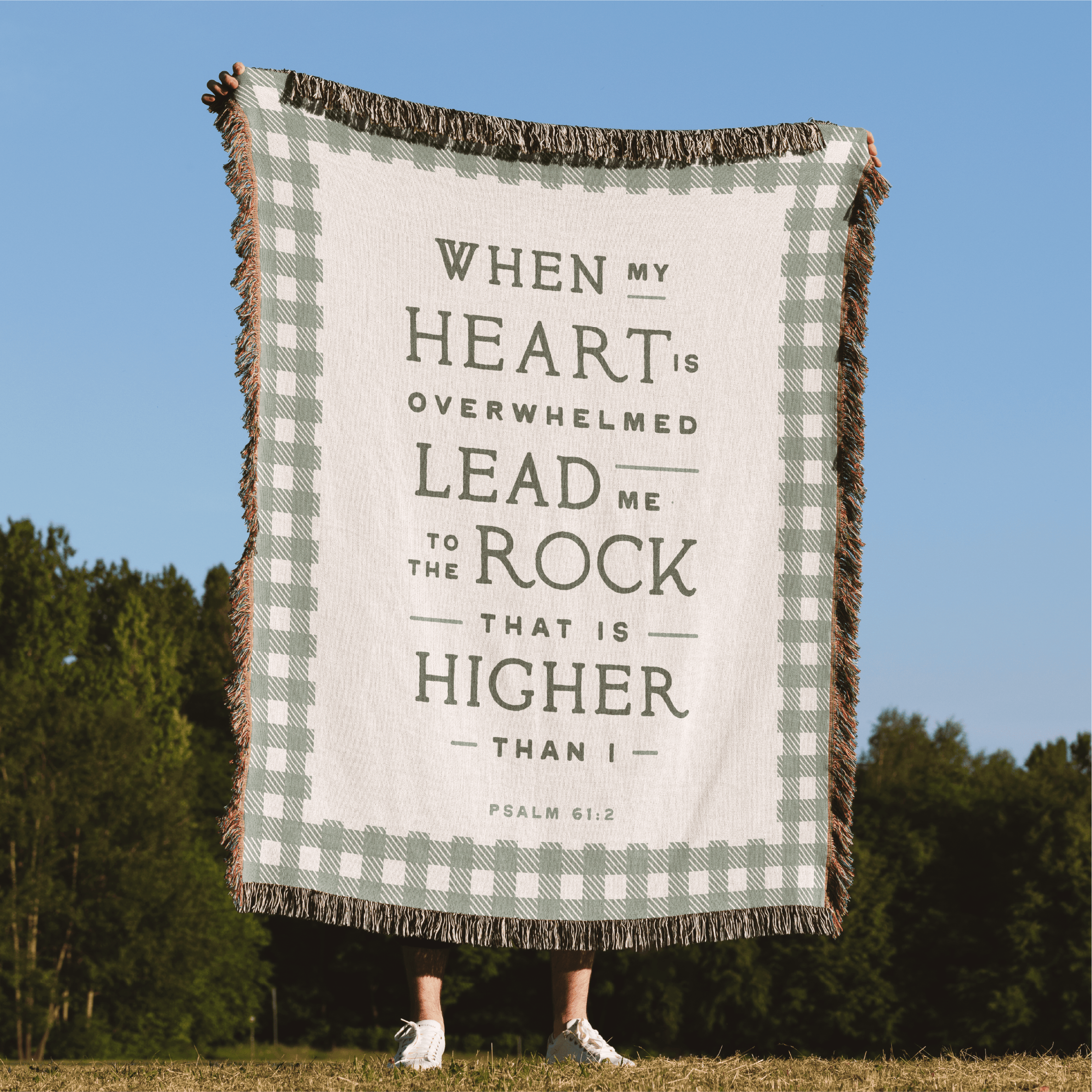 Blanket with motivational quote in a field