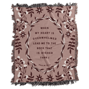 Blanket with floral design and inspirational quote on a white background