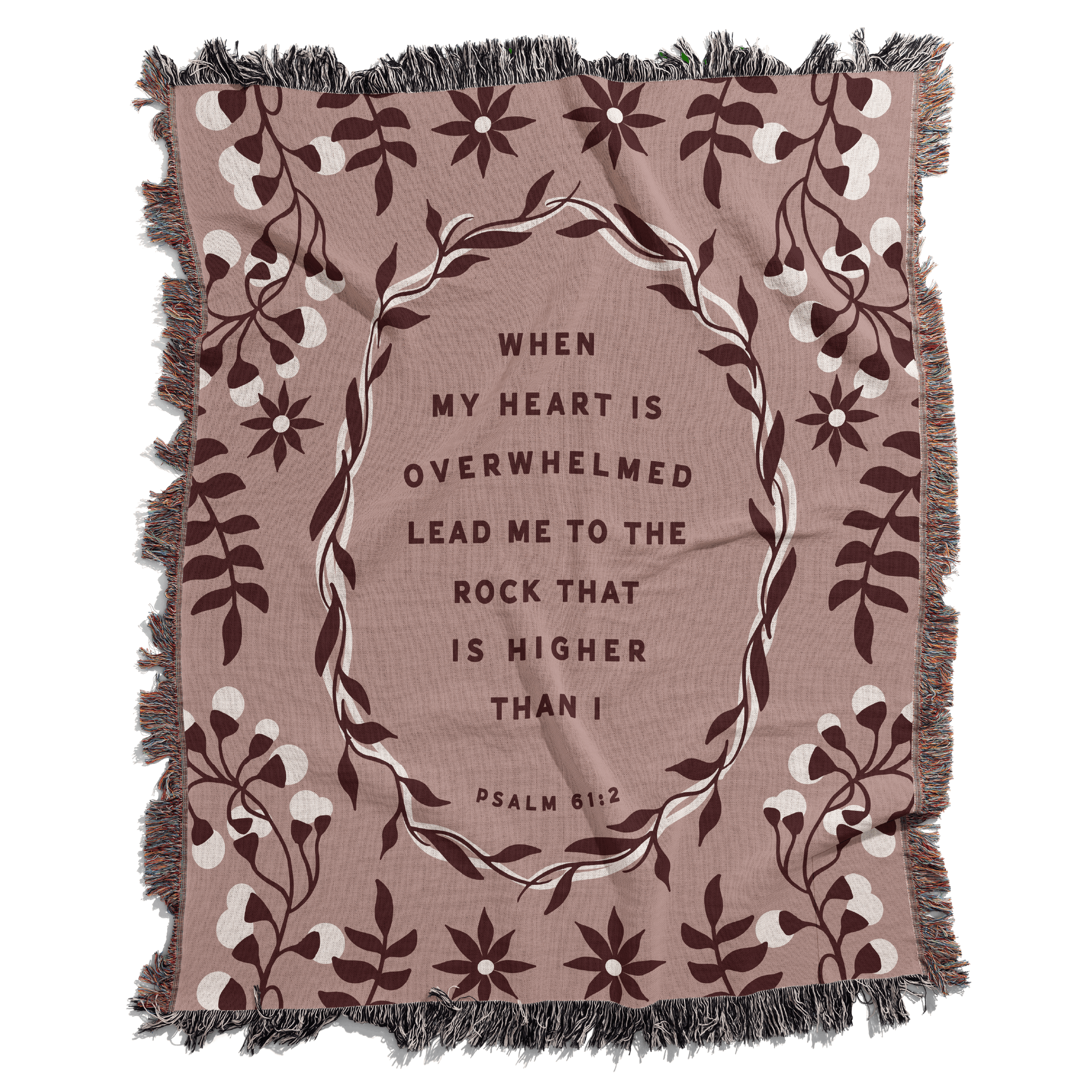Blanket with floral design and inspirational quote on a white background