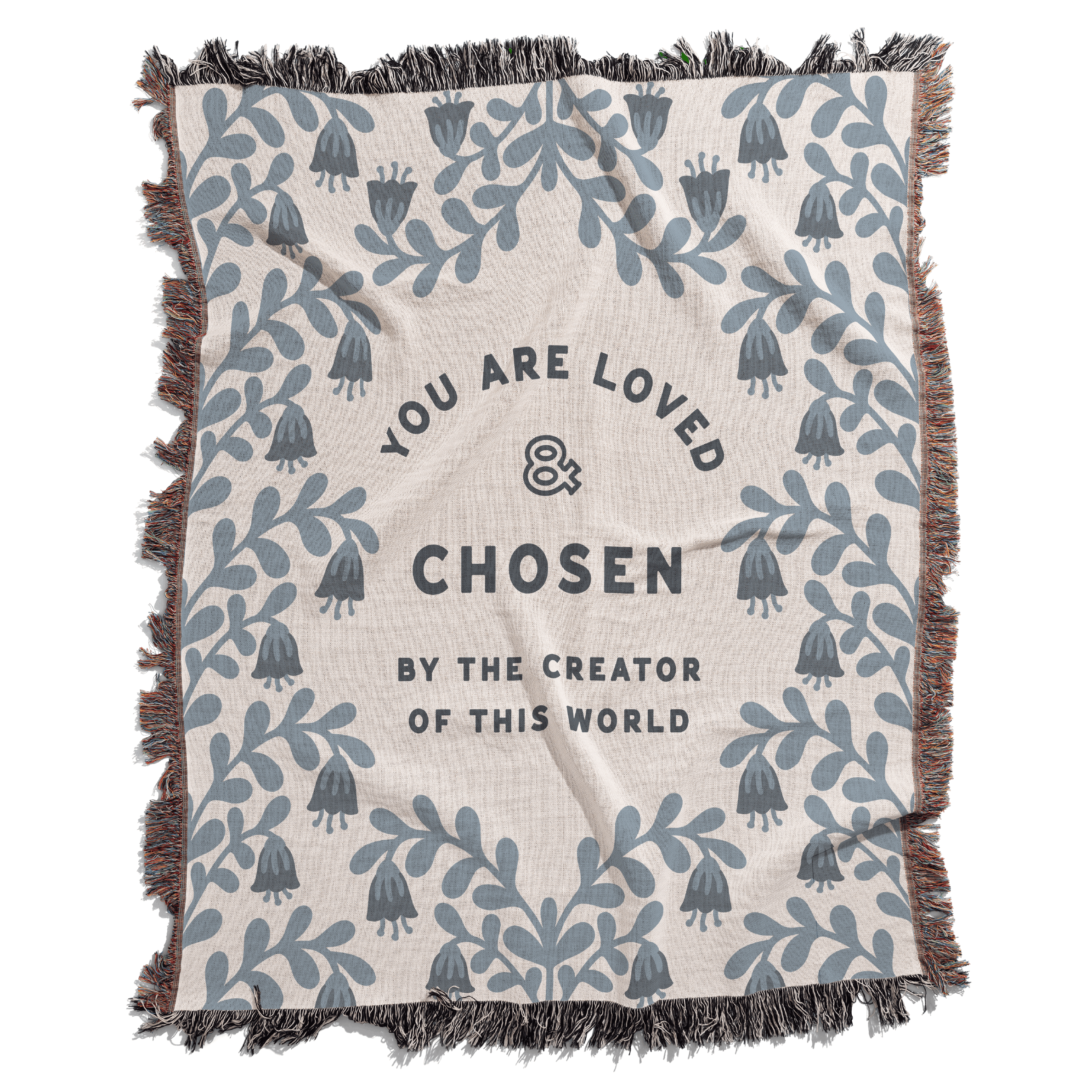 Blanket with blue floral patterns and motivational text on a white background