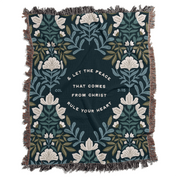 Floral patterned blanket with text on a white background