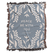 Blue blanket with white leaf patterns and 'Peace Be With You' text on a white background