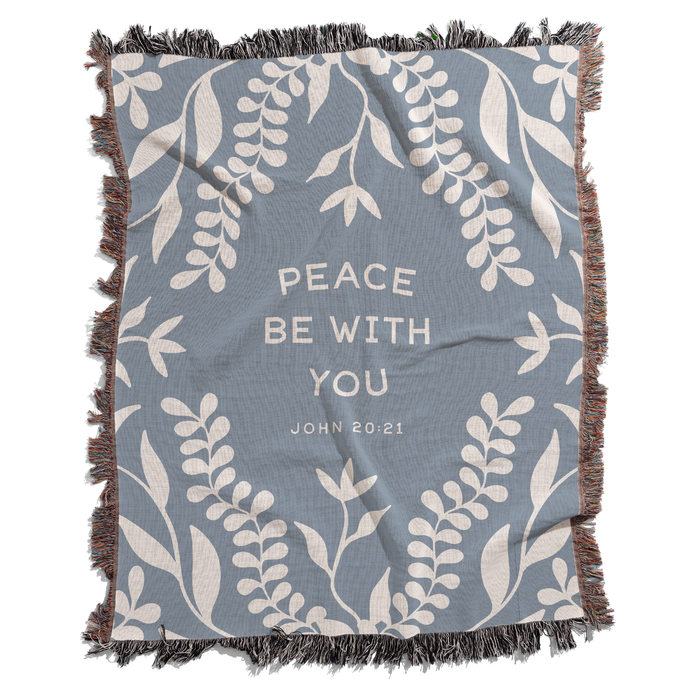 Blue blanket with white leaf patterns and 'Peace Be With You' text on a white background