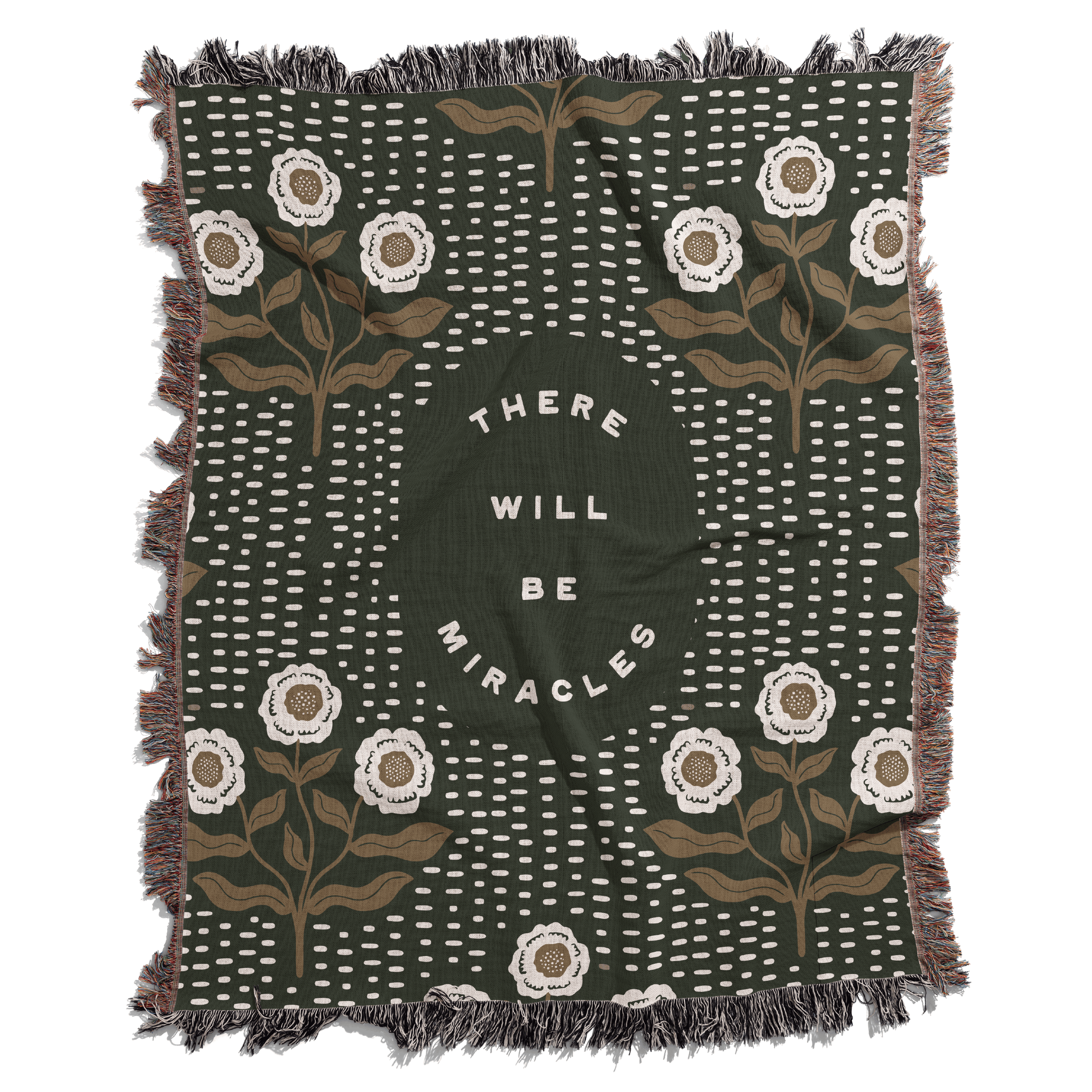Decorative blanket with floral patterns and motivational text on a white background