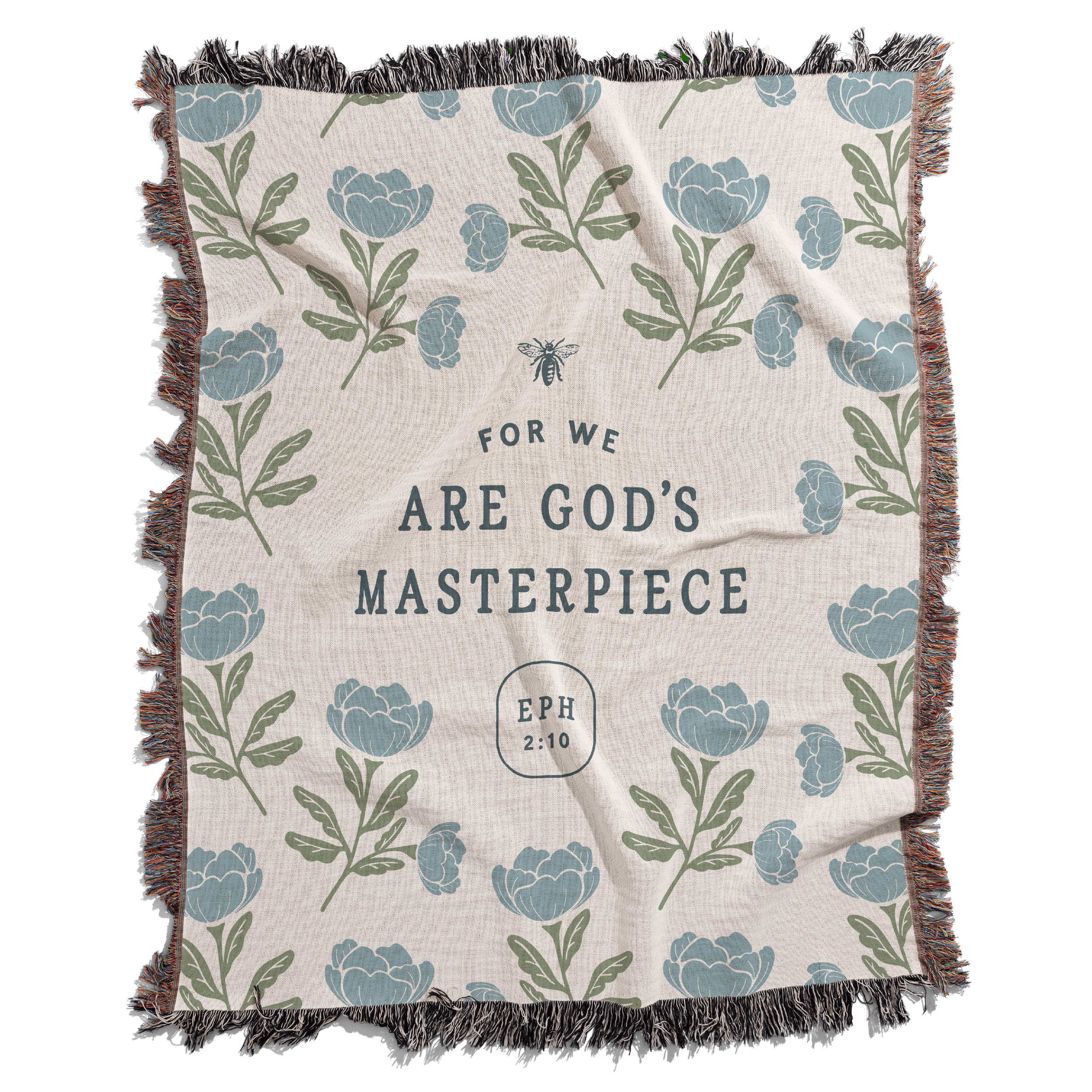 Blanket with floral pattern and text 'For we are God's masterpiece' on a white background
