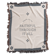 Blanket with 'Faithful Through It All' text and decorative border on a white background