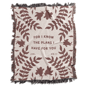 Blanket with leaf pattern and text 'For I know the plans I have for you' on a white background
