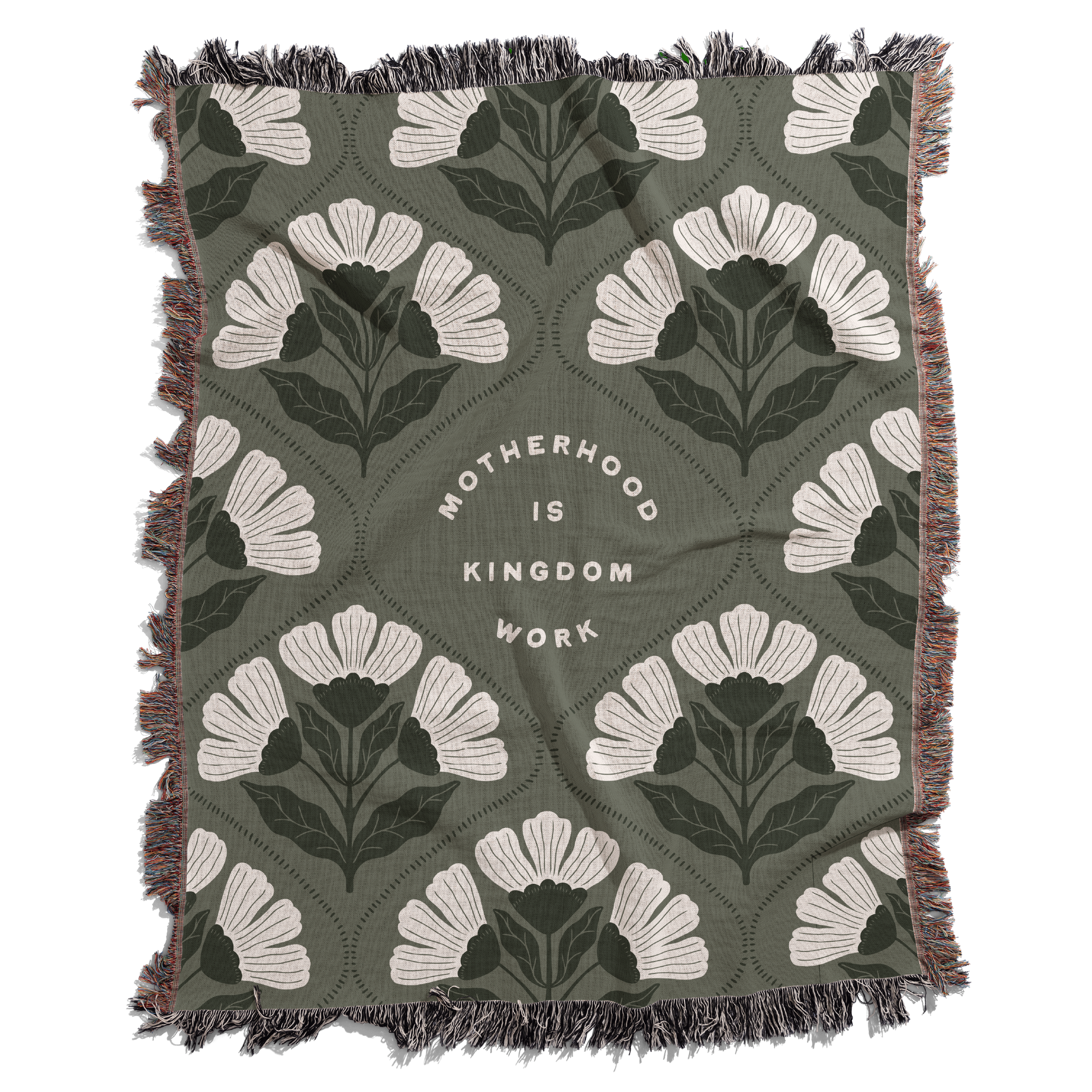 Floral patterned blanket with text 'Motherhood is Kingdom Work' on a green background