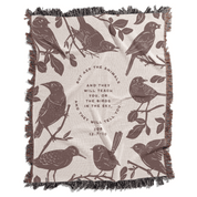 Blanket with bird illustrations and text on a beige background