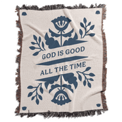Blanket with floral design and 'God is Good All the Time' text on a white background