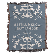 Blue blanket with white text and decorative patterns on a white background