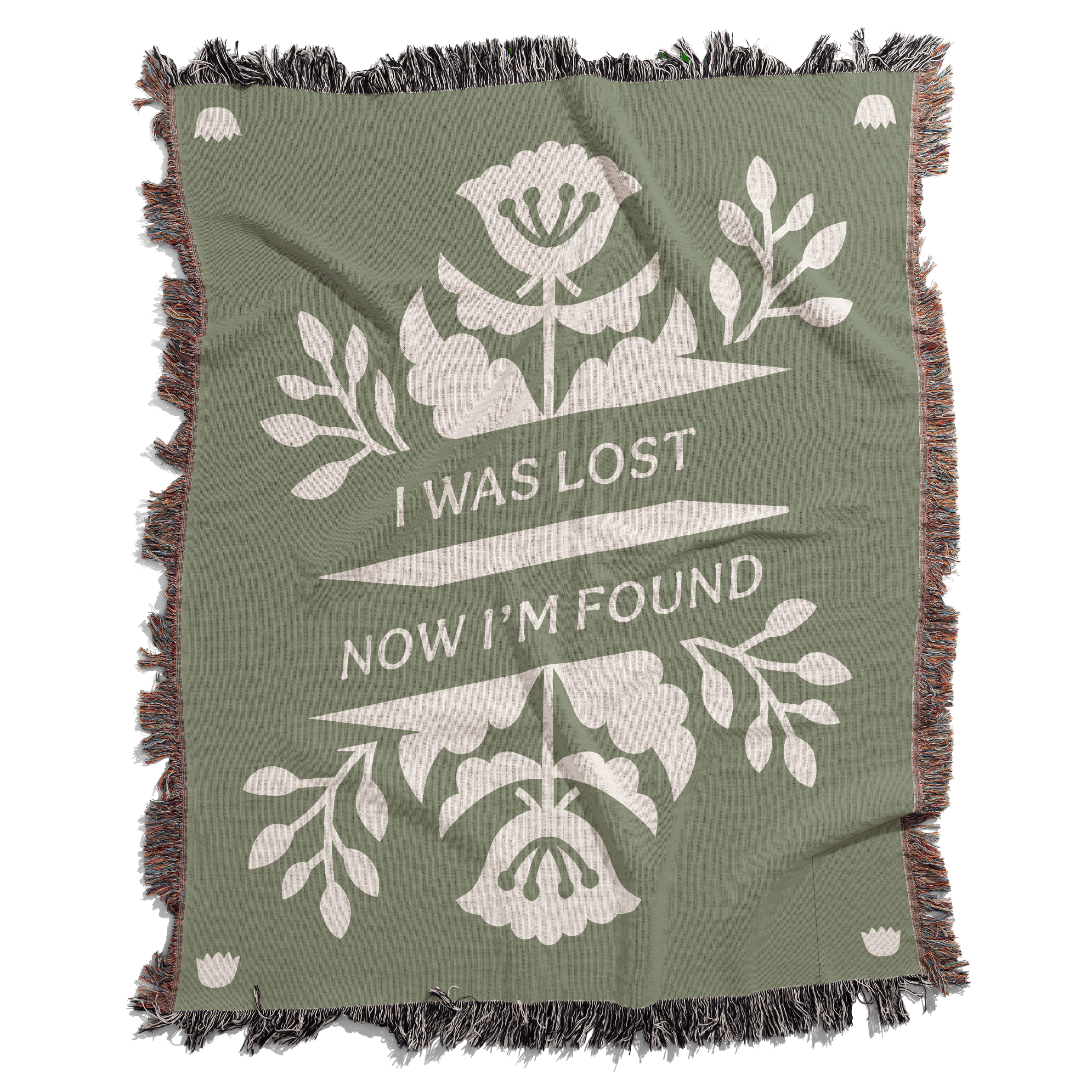 Green blanket with white floral design and text 'I Was Lost Now I'm Found' on a white background