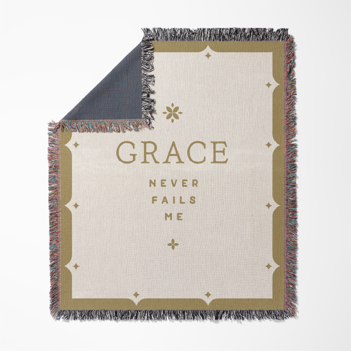 Blanket with 'GRACE NEVER FAILS ME' text on a white background