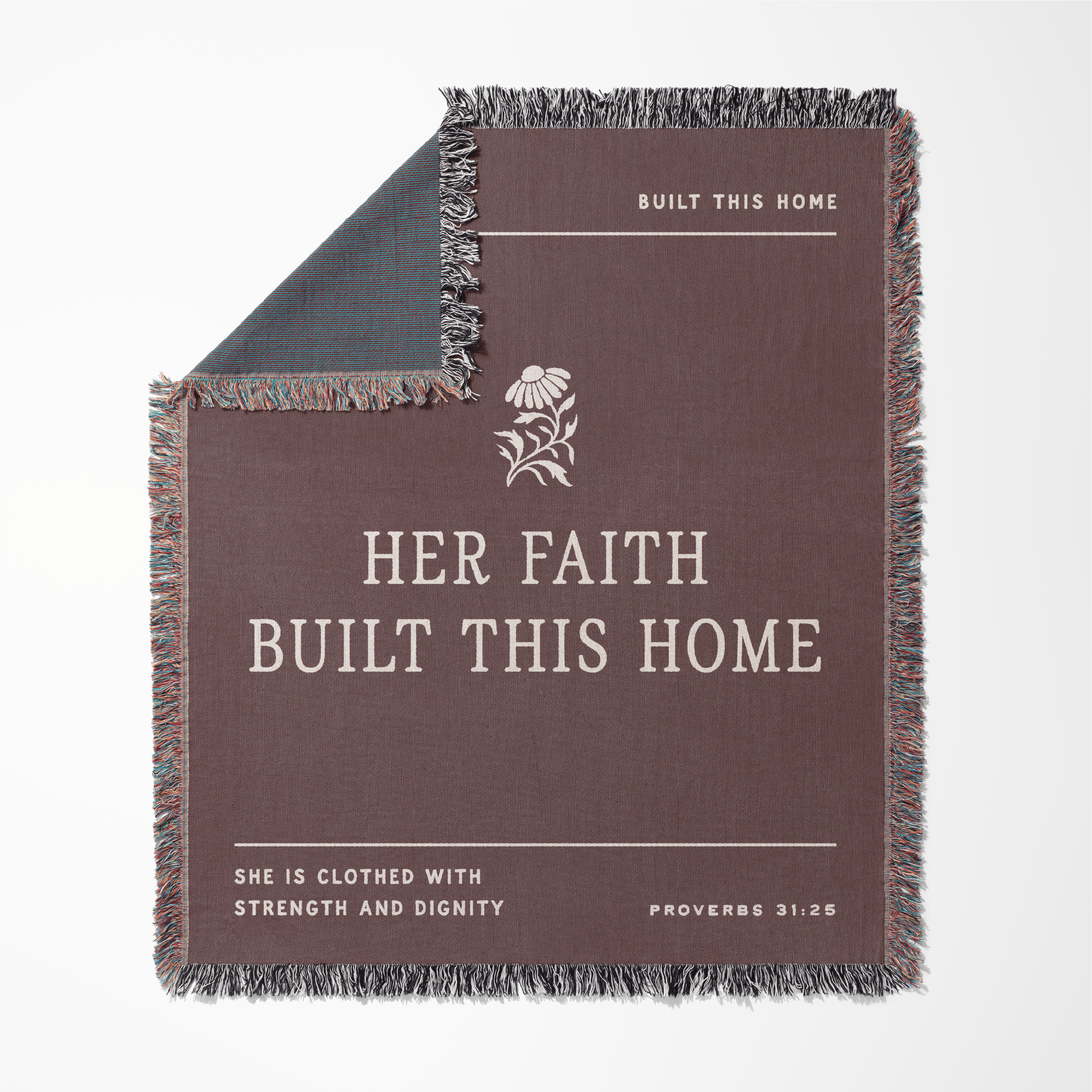 Blanket with text 'Her faith built this home' and Proverbs 31:25 on a white background