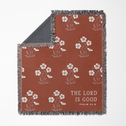 Floral patterned blanket with 'The Lord is Good' text on a white background