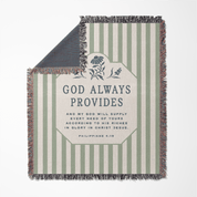 Striped blanket with 'God Always Provides' text and floral design on a white background