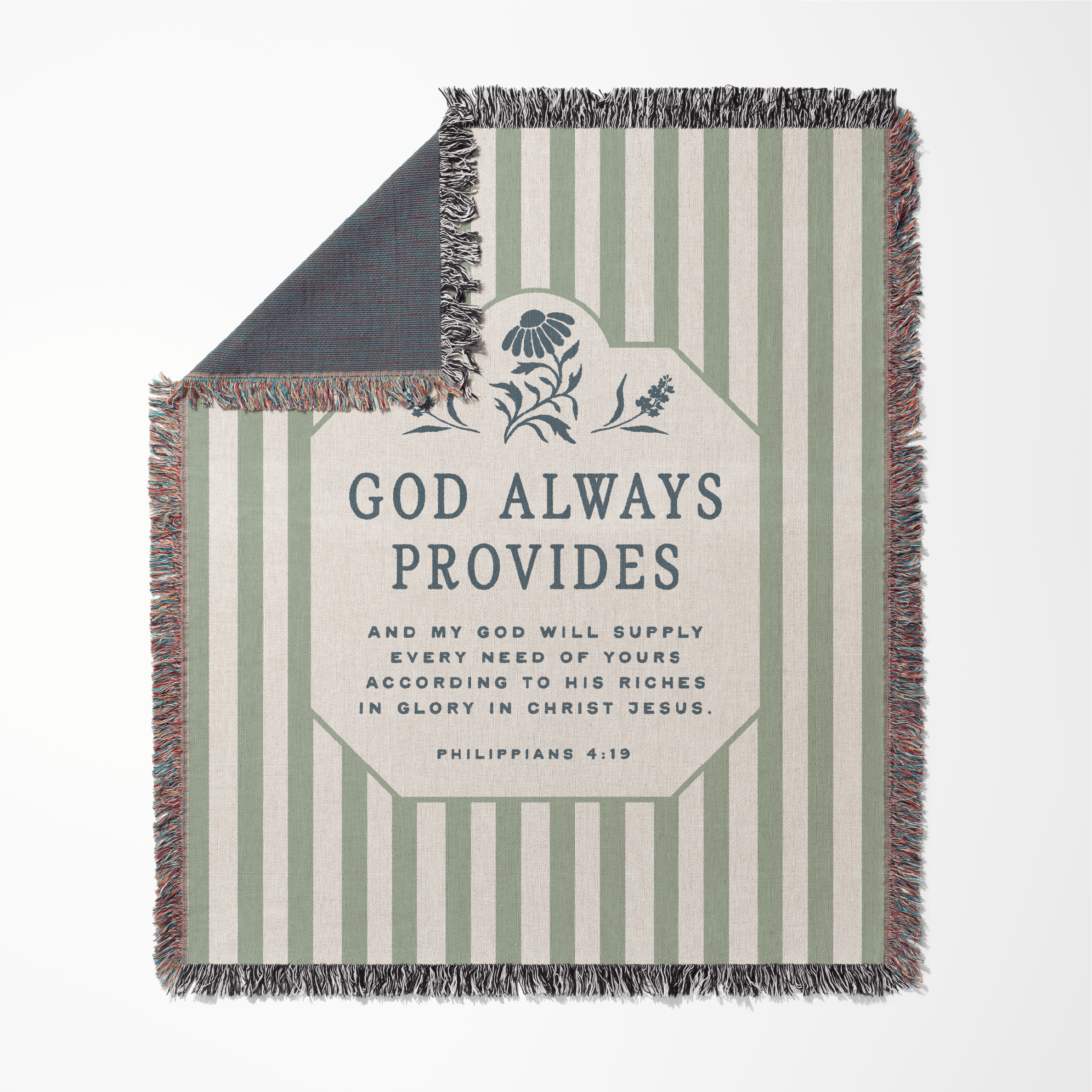 Striped blanket with 'God Always Provides' text and floral design on a white background