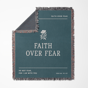 Teal blanket with 'Faith Over Fear' text and flower design on a white background