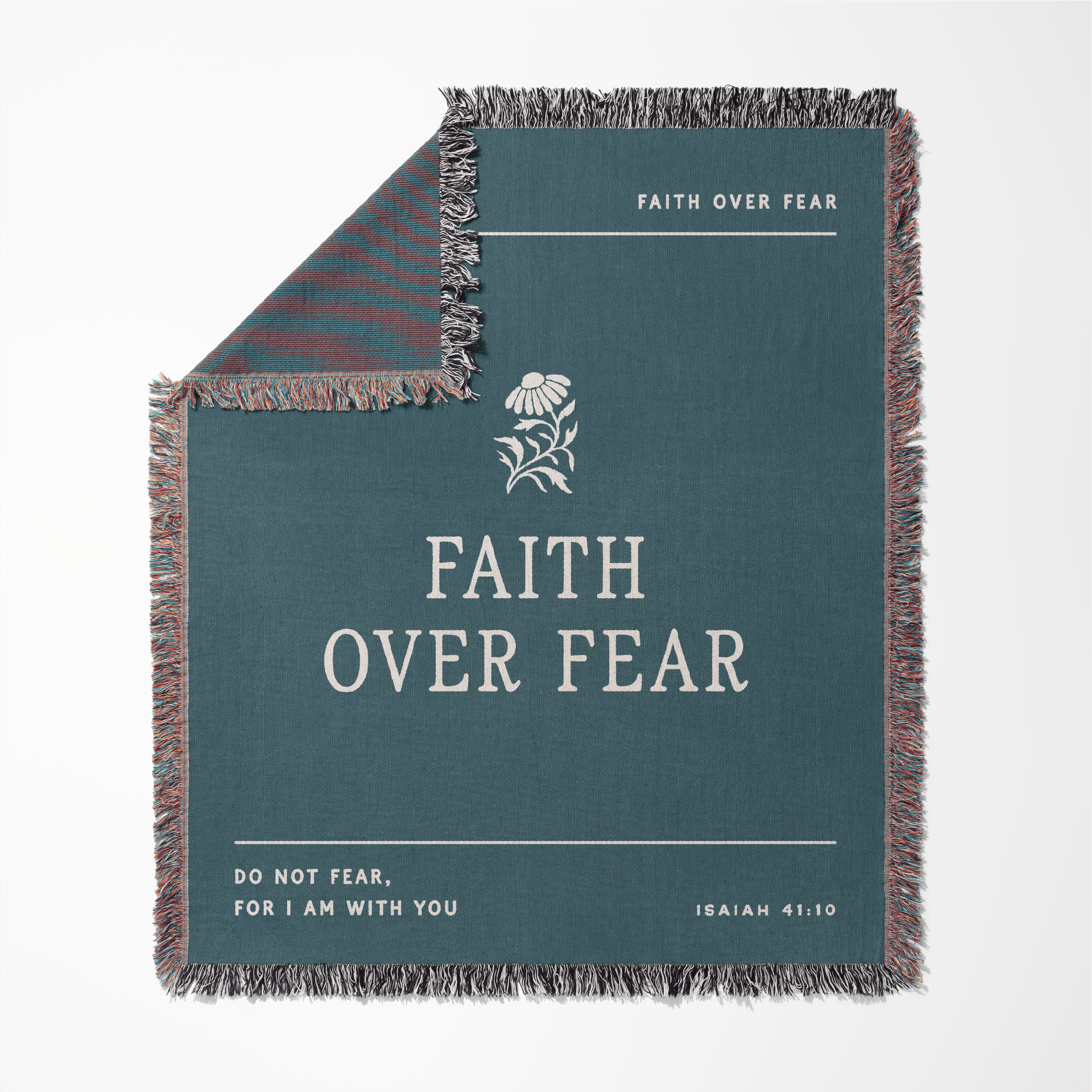 Teal blanket with 'Faith Over Fear' text and flower design on a white background